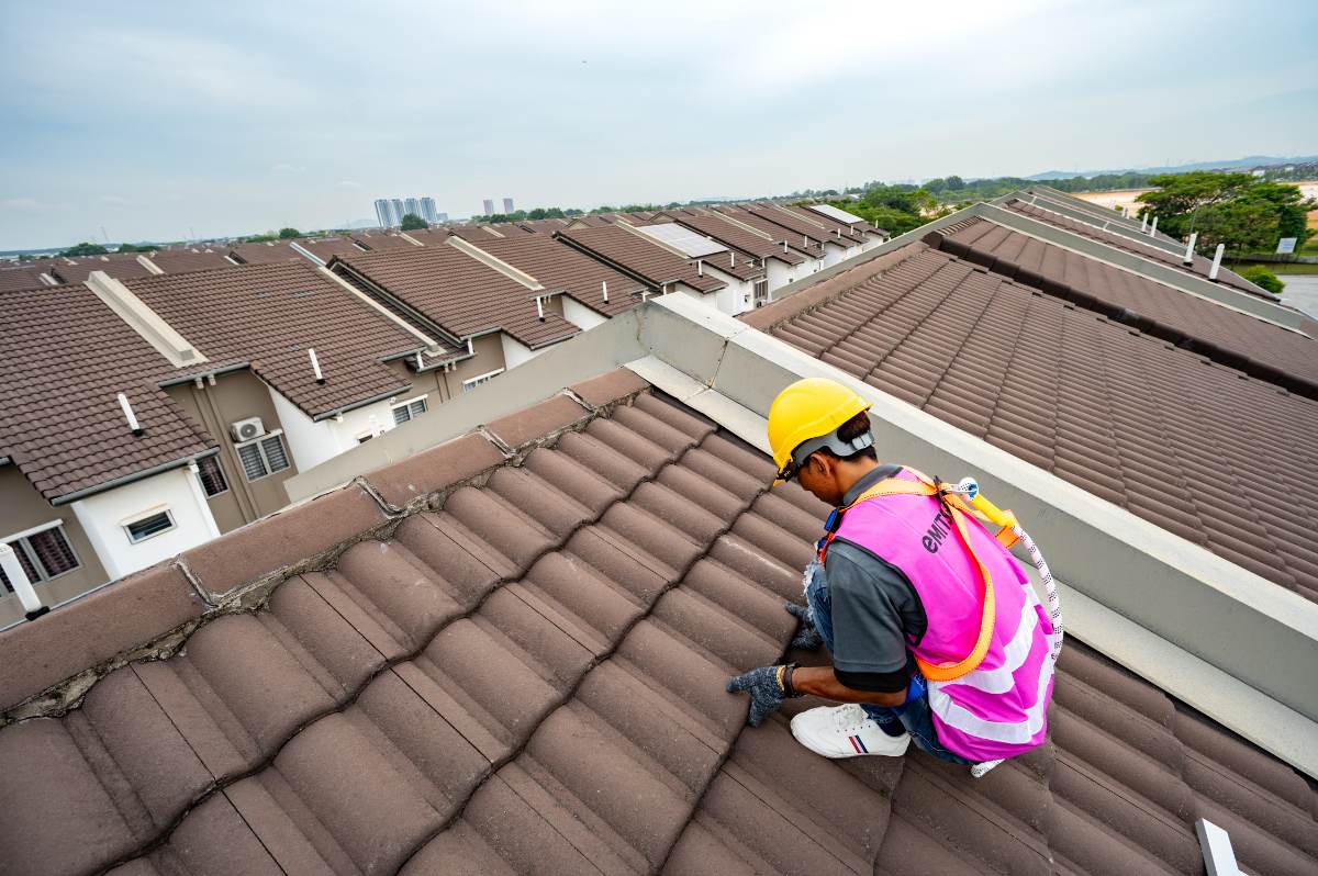 Emit Solar installer on a customer roof
